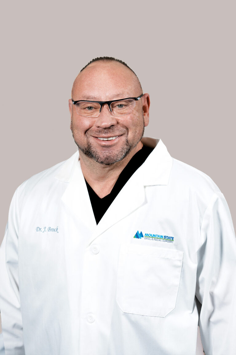 John E. Brock, DDS